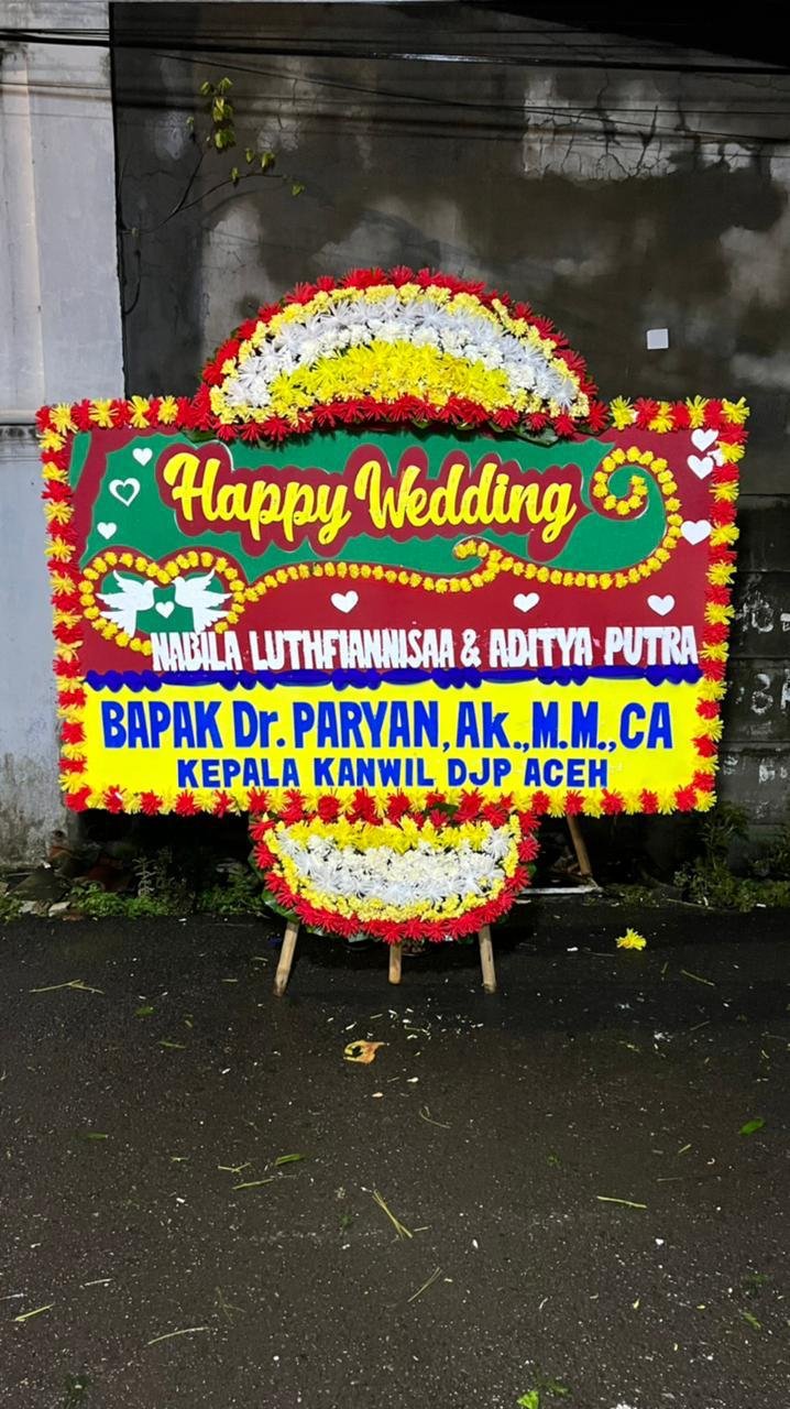 Bunga papan happy wedding untuk pernikahan di kawasan Bintaro